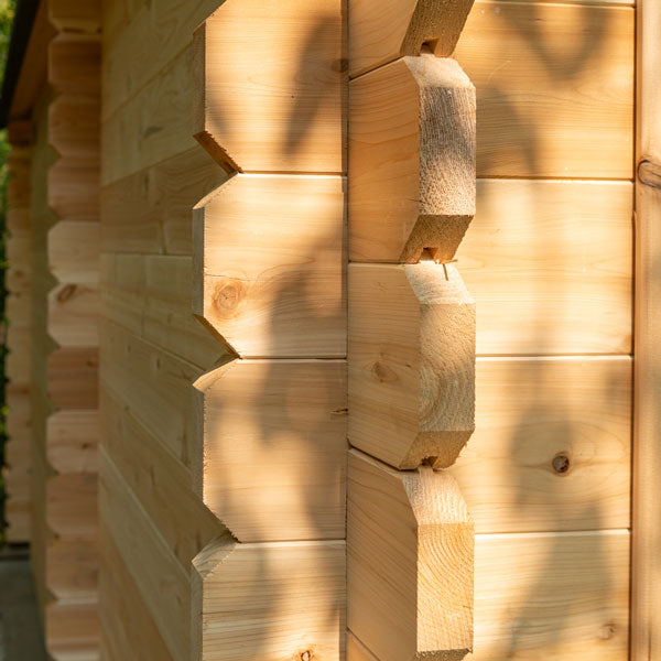 A close up of a Dundalk Canadian Timber CT Georgian Cabin Sauna with Changing Room log cabin by Dundalk LeisureCraft.