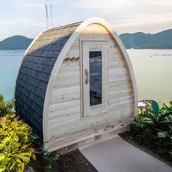 A Dundalk Canadian Timber CT MiniPOD Sauna with a view of the ocean.