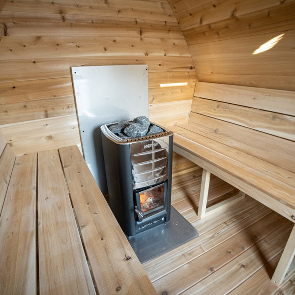 Experience a relaxing retreat in our Dundalk Canadian Timber CT MiniPOD Sauna from Dundalk LeisureCraft, complete with a cozy wood burning stove.
