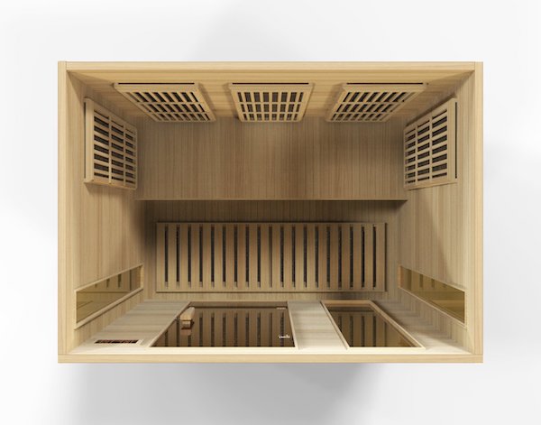 A Maxxus 3-Person Low EMF FAR infrared sauna, made from Canadian Hemlock and known for its energy efficiency, housed in a wooden box.