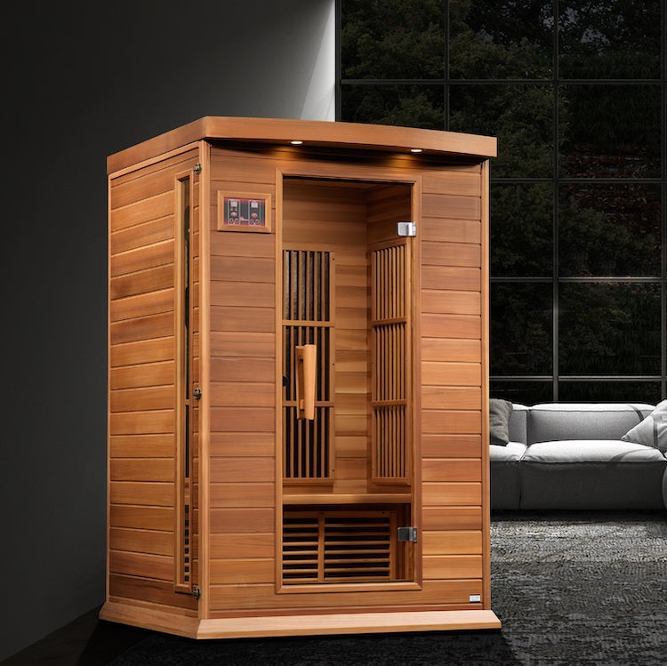 A Maxxus Saunas 2-Person Near Zero EMF FAR Infrared Sauna made of Canadian Reforested Red Cedar Wood in a living room.