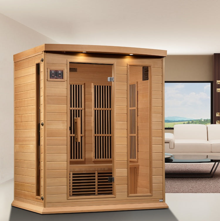 A Maxxus 3-Person Near Zero EMF FAR Infrared Sauna (Canadian Hemlock) in a living room, designed with consideration for SEO and EMF levels.