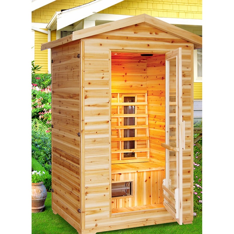 A SunRay Saunas Burlington 2 Person Outdoor Infrared Sauna HL200D with ceramic heaters in a backyard.
