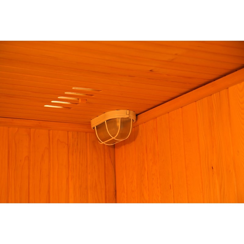 A SunRay Saunas Baldwin 2 Person Traditional Sauna HL200SN made of wood with a light in the ceiling.