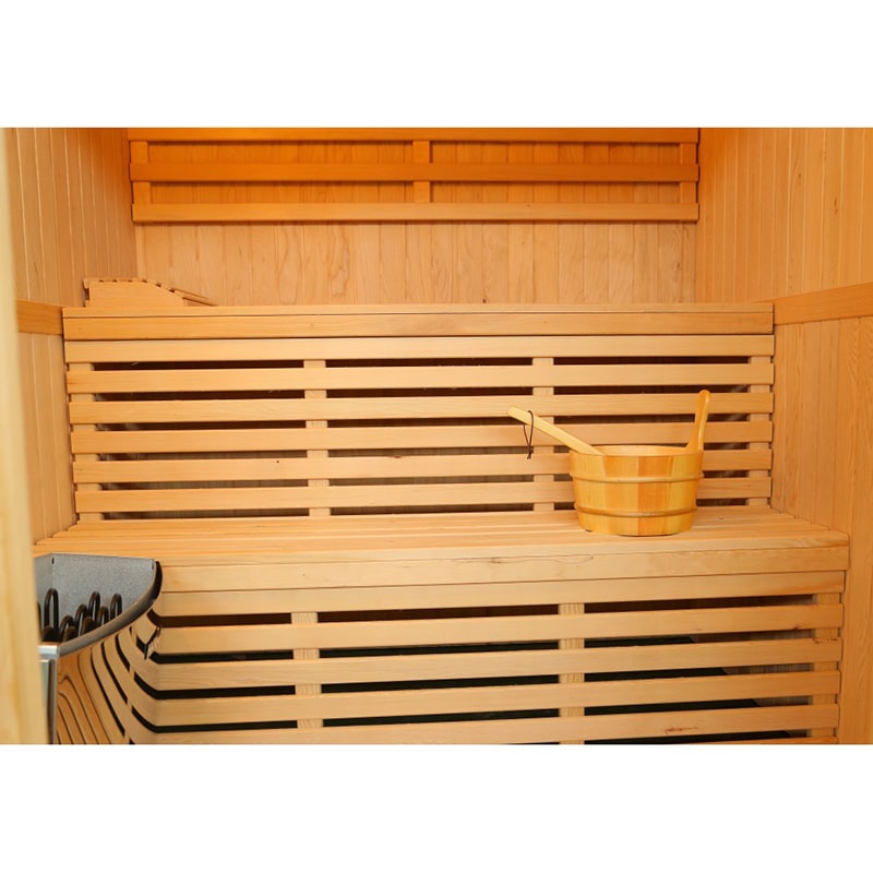 A SunRay Tiburon 4 Person Traditional Sauna HL400SN with wooden slats and a heater.