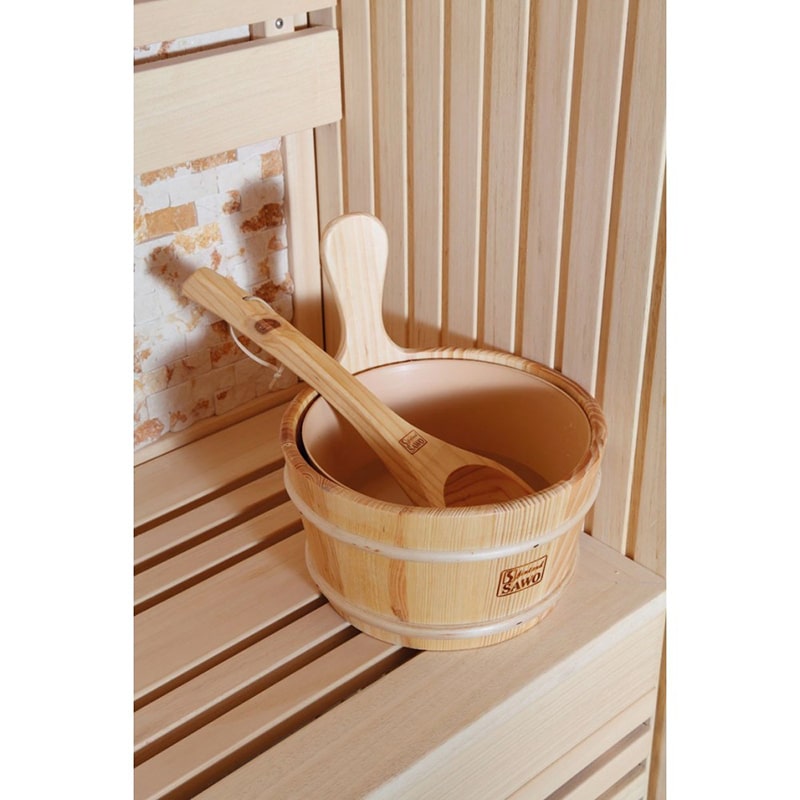In a SunRay Saunas traditional sauna room, a SunRay Tiburon 4 Person Traditional Sauna HL400SN wooden bowl and spoon complement the warmth of the sauna heater.